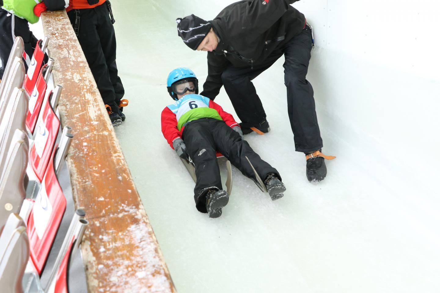 child learning luge