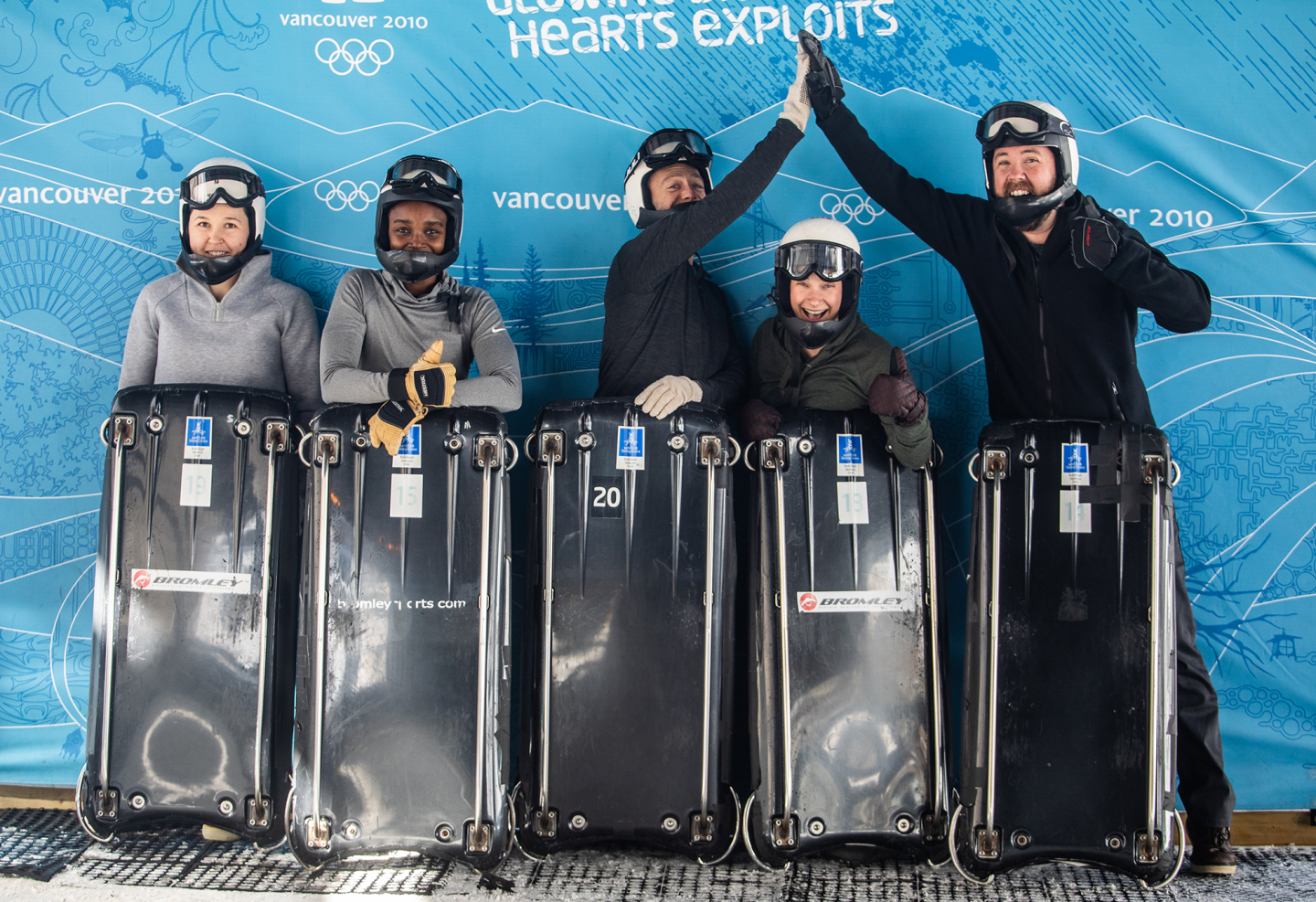 group of participants taking photo with skeleton board