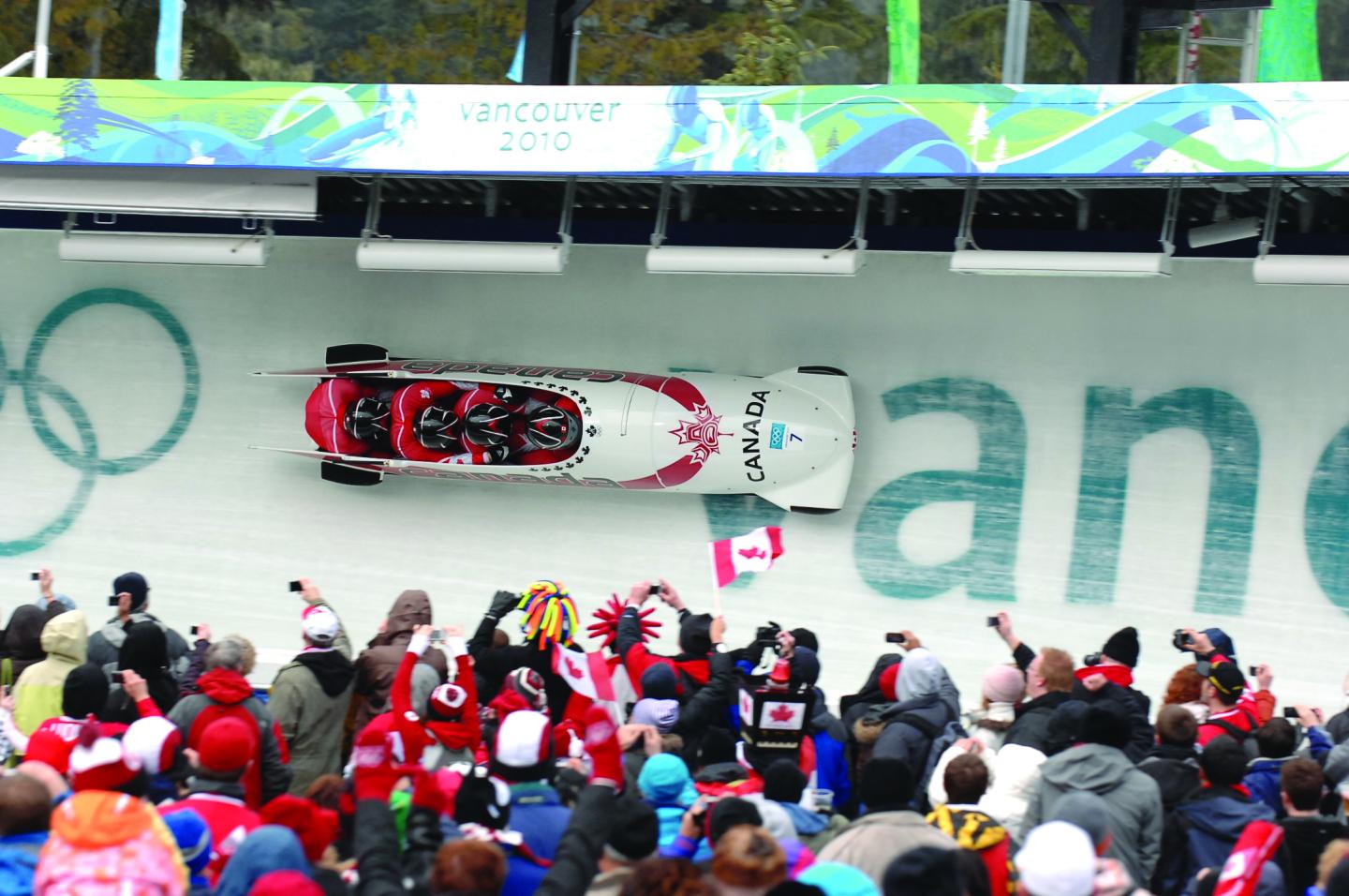 Bobsleigh on track with spectators at olympics