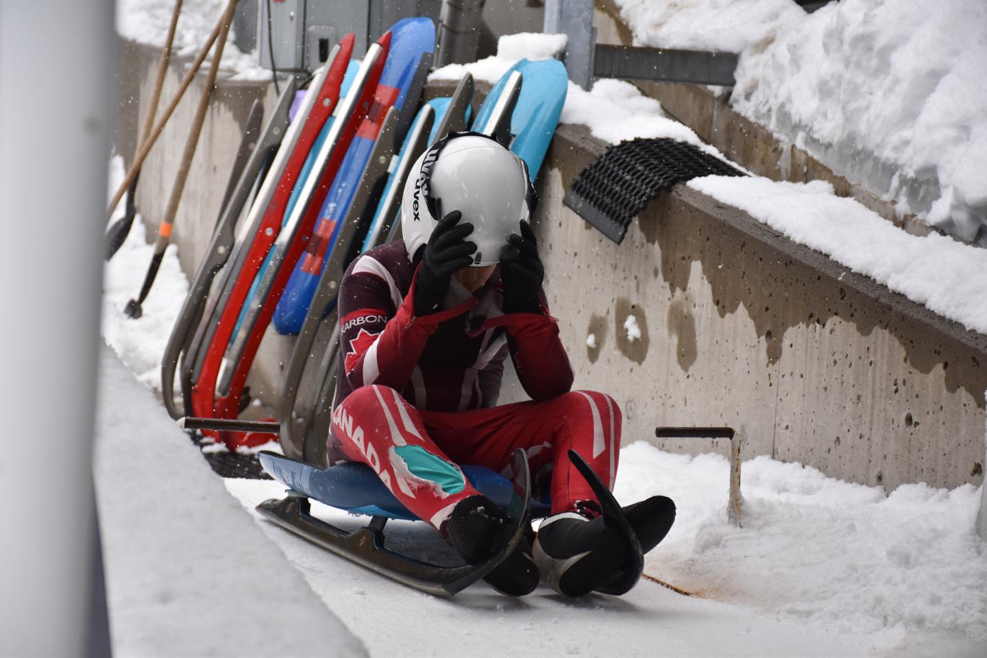 kid getting ready in luge sled