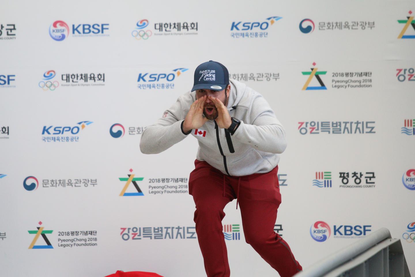 Coach shouting encouraging words at athletes