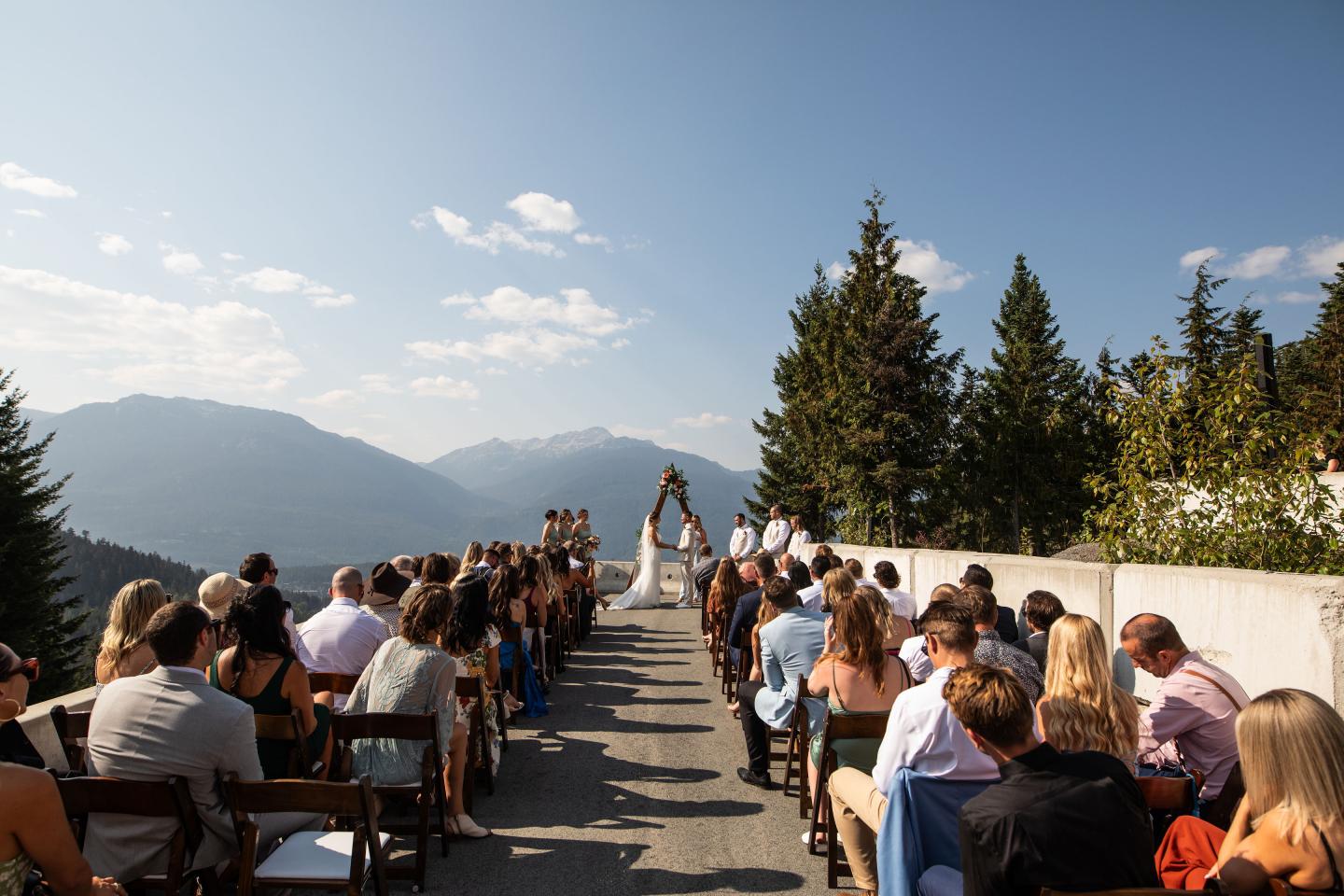 Wedding ceremony overlooking mountain background