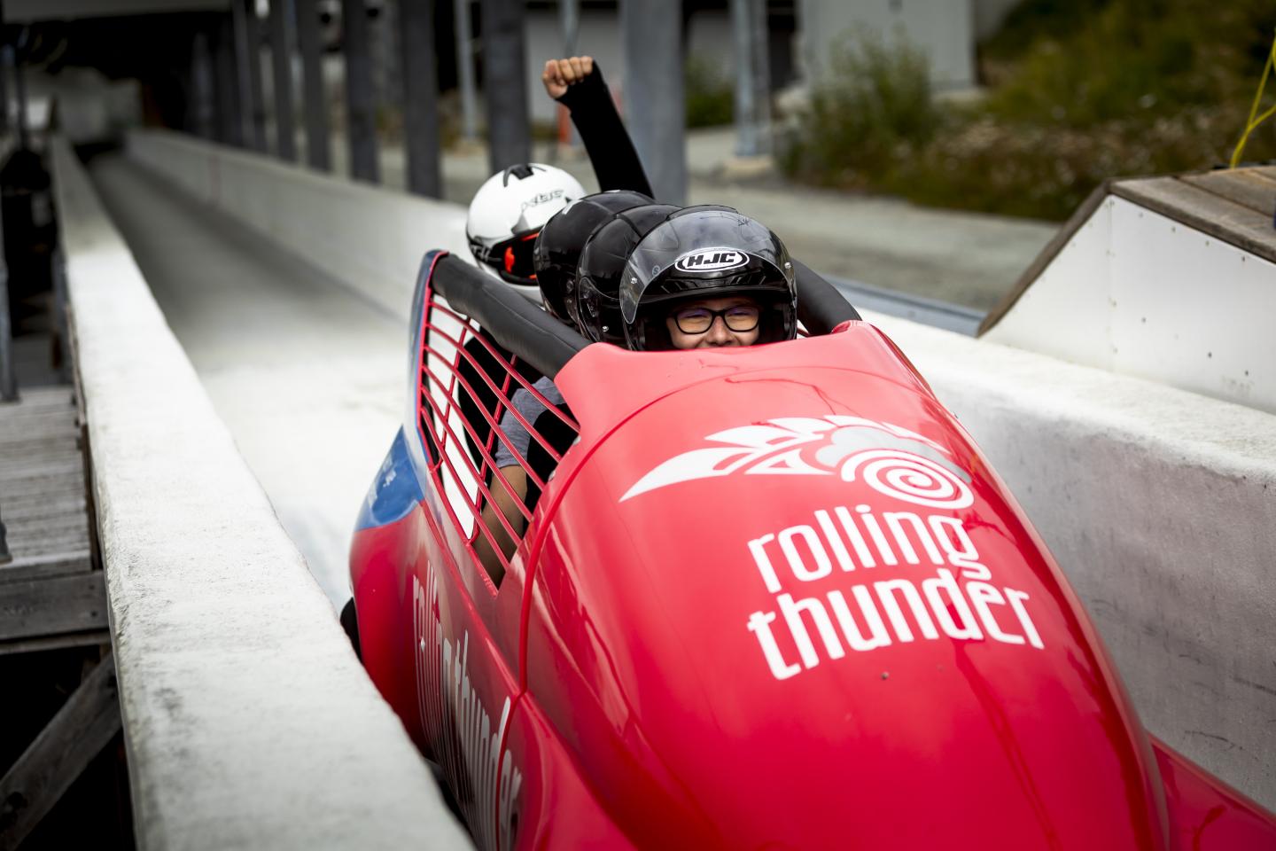 passengers in summer bobsleigh on the track