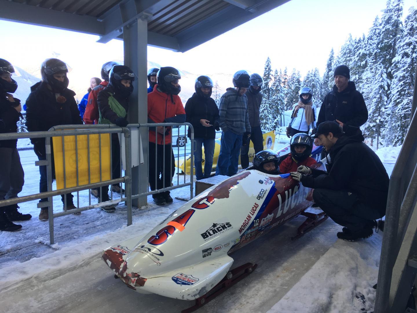 coach with person in bobsleigh