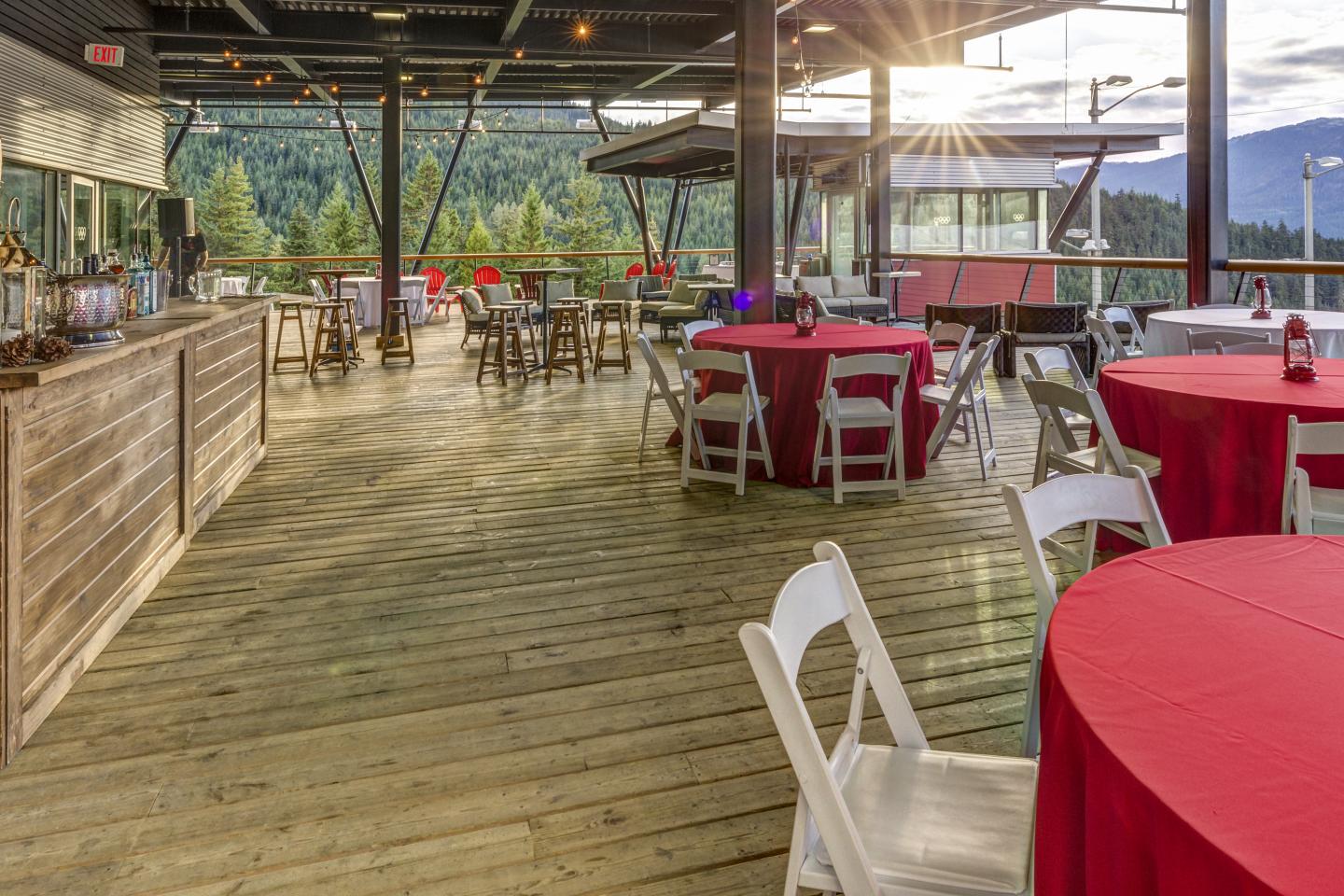 tables and tables setup on patio at outdoor venue in the mountains