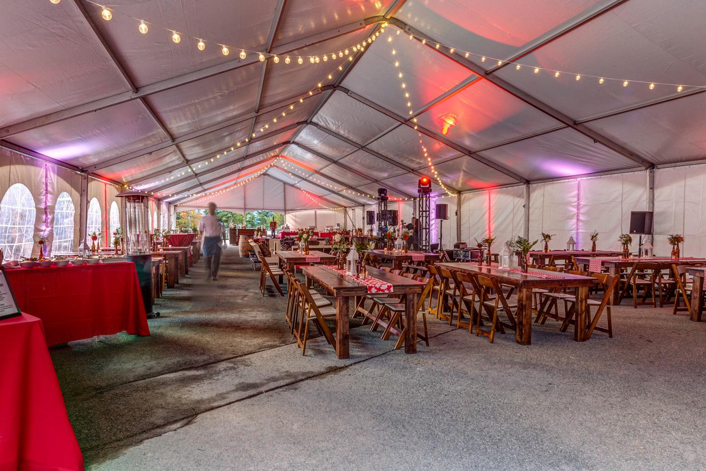 benches and tables setup inside venue tent