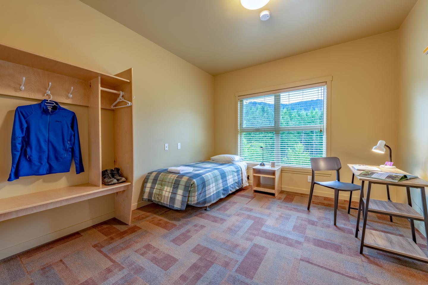 athlete accommodation with single bed and desk