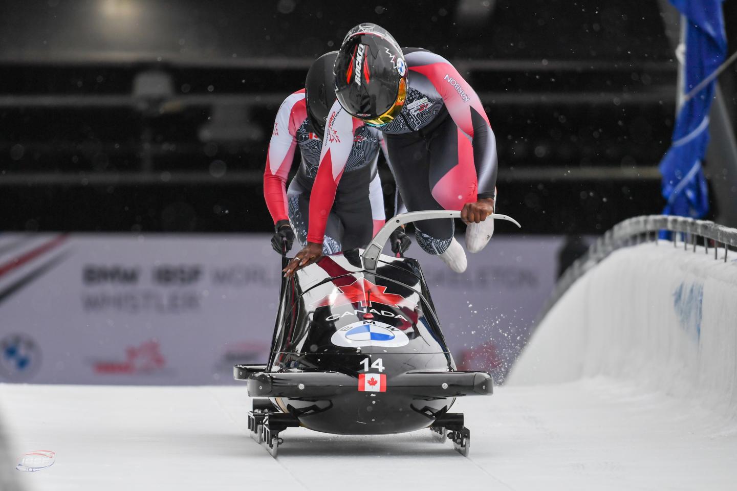 2-person women's bobsleigh team take off at start line